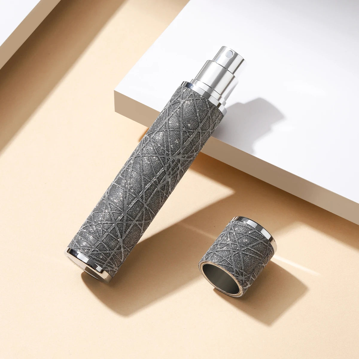 Portable 5ML leather perfume bottle with refillable sprayer, compact travel atomizer for fragrances.