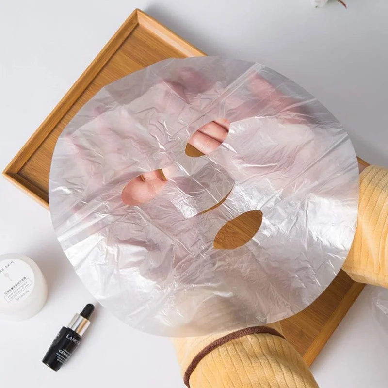 Transparent disposable plastic full face cleaner mask with neck stickers, ideal for facial beauty and makeup application.