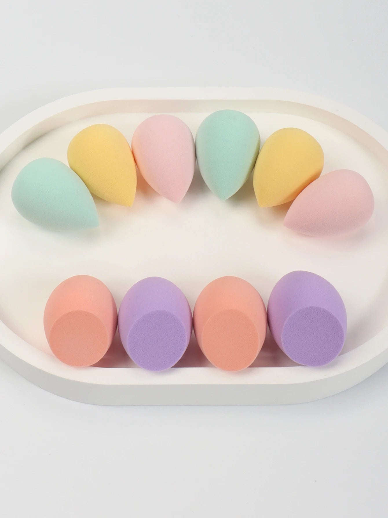 Set of 10 mini makeup sponge puffs for foundation, concealer, and face cosmetics, perfect for blending and flawless makeup application.