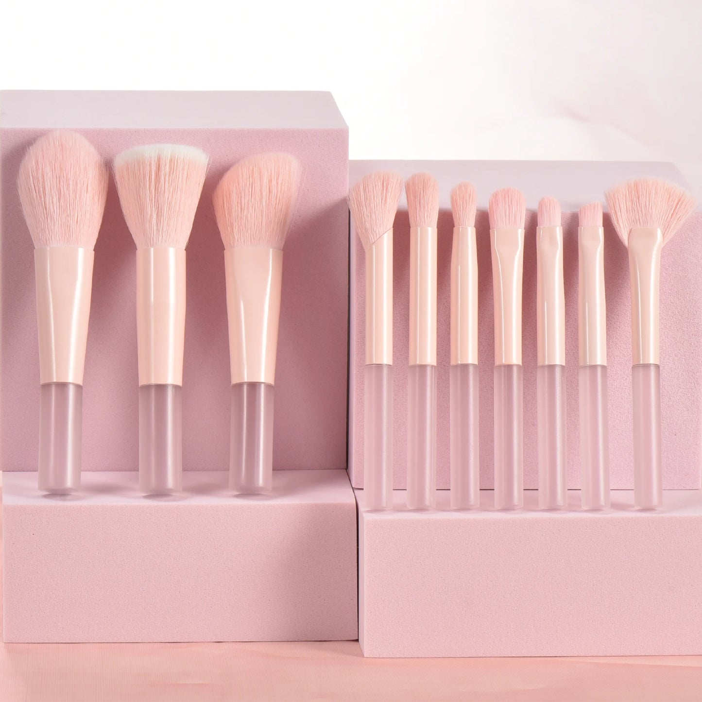 Set of 10 pink mini portable makeup brushes and puffs from Amzzonstore, ideal for travel and professional makeup application.