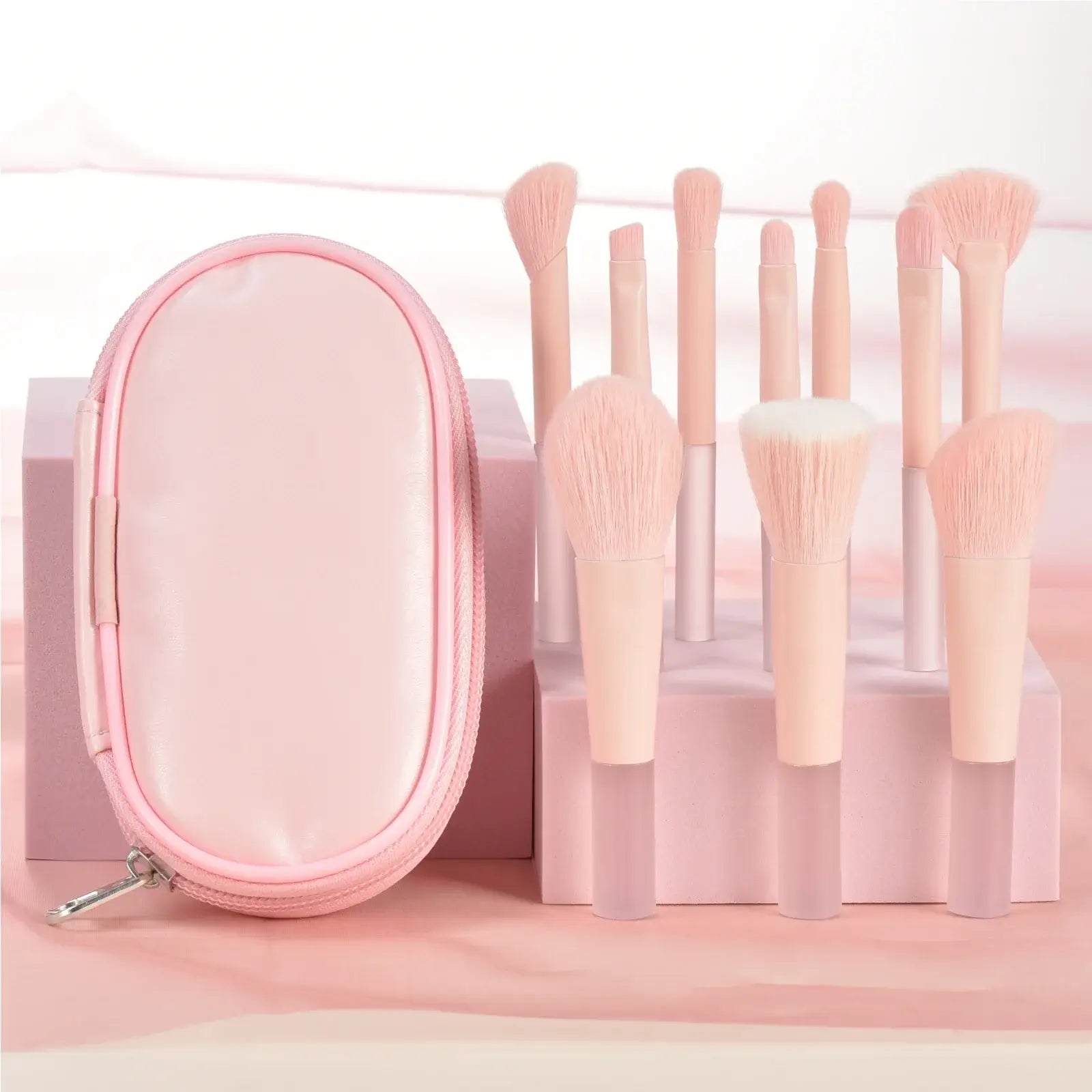 Pink mini travel makeup brushes set with professional palm brushes and puffs, ideal for portable makeup application.