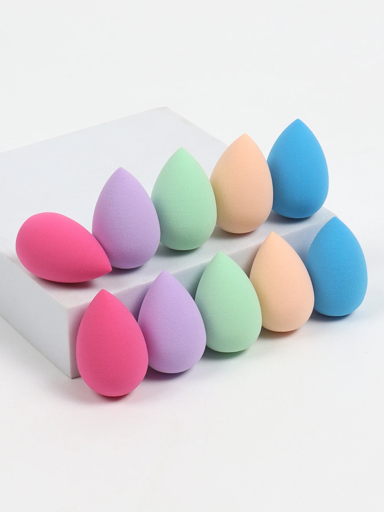 Set of 10 mini makeup sponges by amzzonstore, soft powder puffs for foundation, concealer, and liquid makeup application.