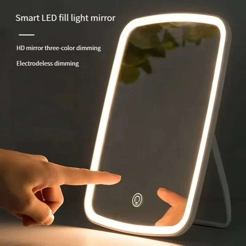 LED makeup mirror with stand, folding compact square design, portable vanity mirror with touch screen and built-in lighting.
