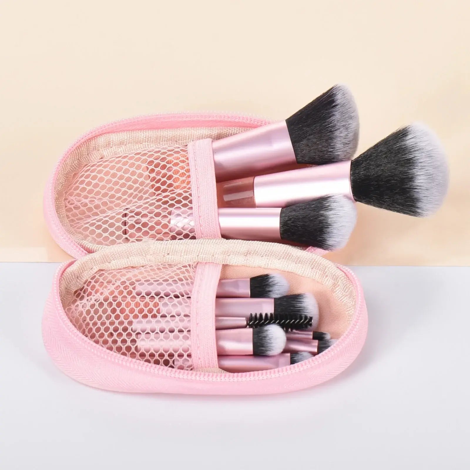 Set of 10 pink mini portable makeup brushes and puffs from amzzonstore, ideal for travel and professional makeup application.
