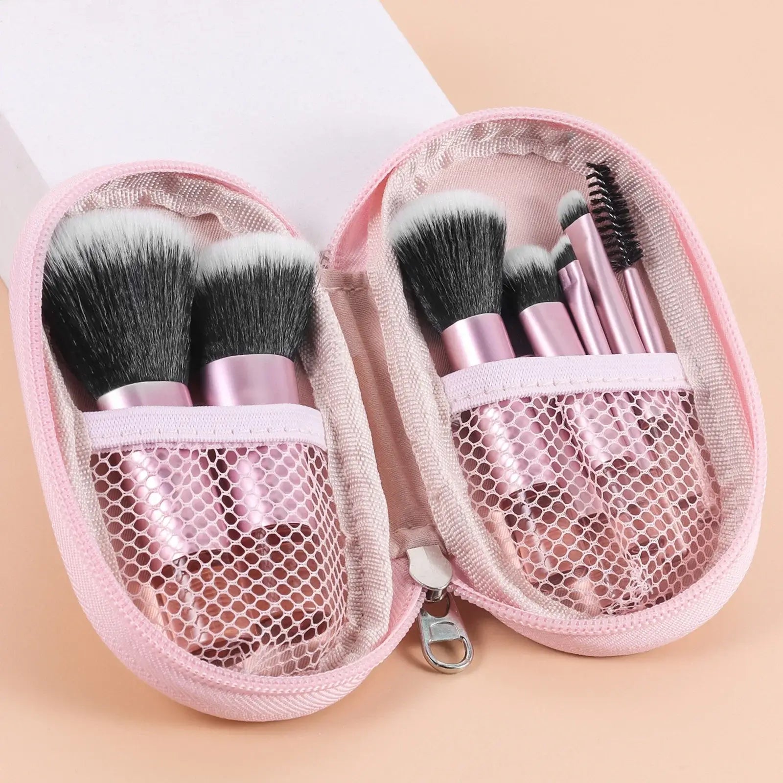 Set of 10 pink mini makeup brushes from amzzonstore, portable palm brush tools for professional makeup application.