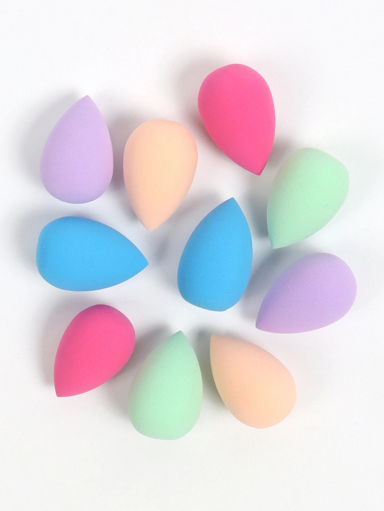 Set of 10 mini makeup sponges by amzzonstore for foundation, concealer, and powder application, featuring soft, versatile cosmetic puffs.
