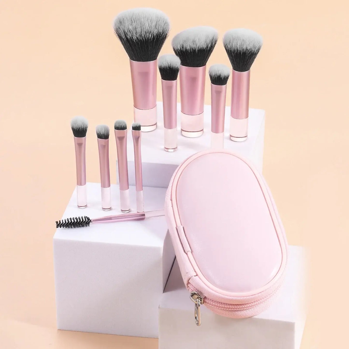 Set of 10 pink mini portable makeup brushes from amzzonstore, ideal for travel, includes palm brushes and makeup puffs.