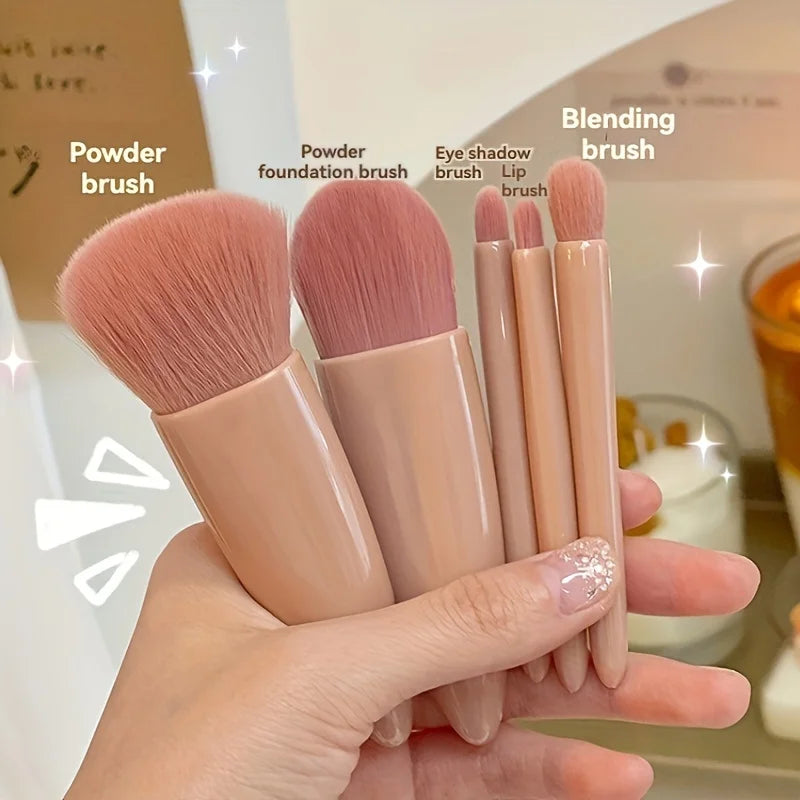 Mini portable makeup brush set with mirror, foldable travel cosmetics kit, includes five brushes for on-the-go beauty routines