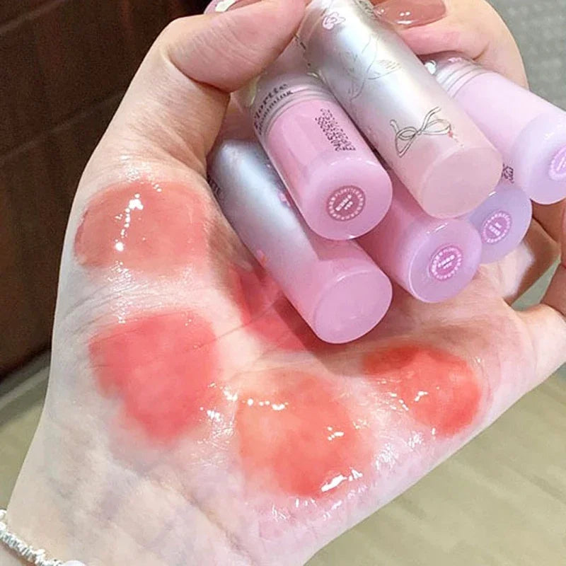 Amzzonstore water-light round tube lip gloss with natural nude peach tint, moisturizing and glossy jelly finish for lips.