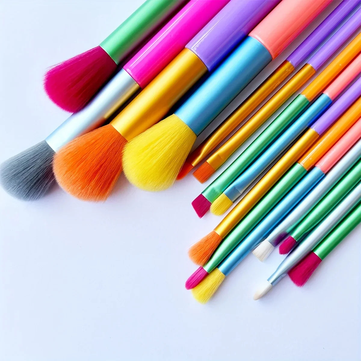 Set of 15 colorful makeup brushes including foundation, blush, concealer, eyeshadow, and blending brushes from amzzonstore.