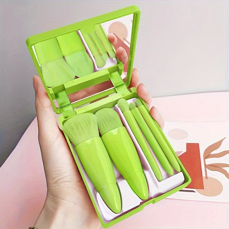 Portable 5-piece mini makeup brush set with mirror by amzzon.store, foldable travel cosmetics kit for on-the-go beauty routines.