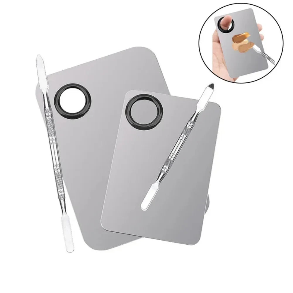Stainless steel makeup mixing palette with spatula and mixing stick, ideal for foundation, lipstick, eyeshadow, and beauty applications.