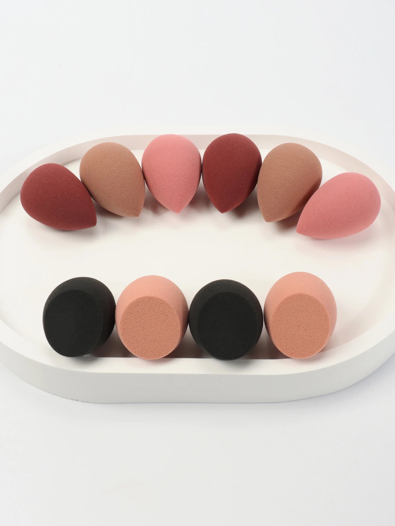 Mini makeup sponge set with 10 cosmetic puffs for foundation, concealer, and powder application by amzzonstore.