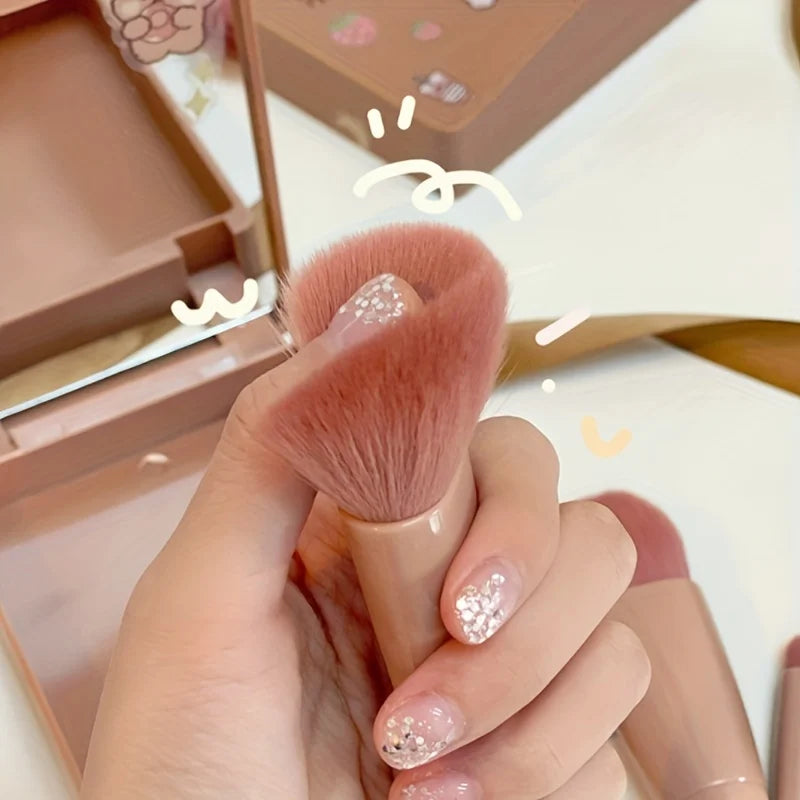 Portable 5-piece mini makeup brush set with mirror from amzzon.store, foldable travel cosmetics kit for on-the-go beauty routines.