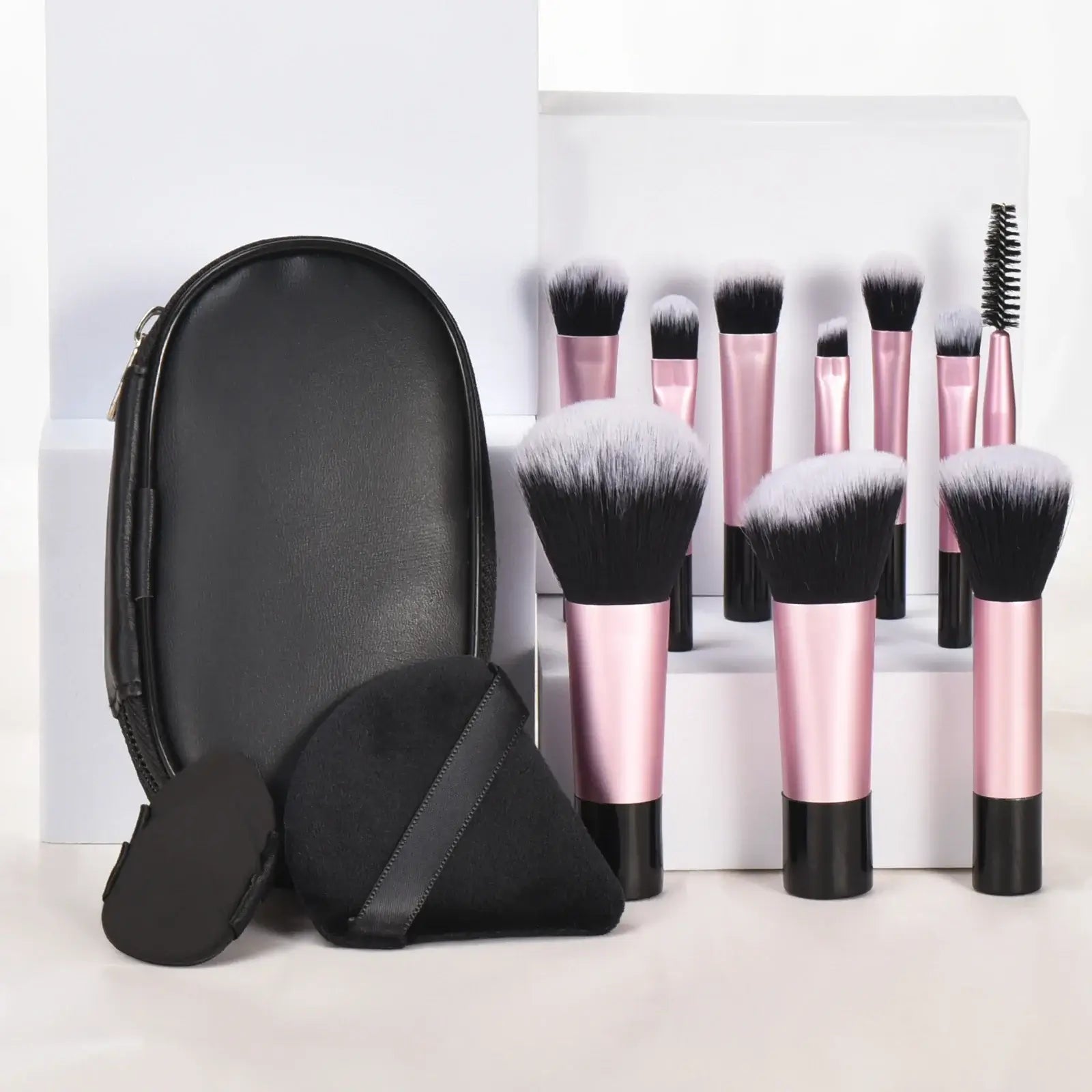 Pink mini makeup brush set by amzzonstore with 10 portable palm-sized brushes for professional makeup application.