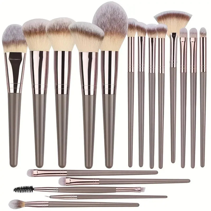 Set of professional makeup brushes including foundation, eyeshadow, blush, and kabuki brushes with soft, fluffy bristles for women’s beauty.