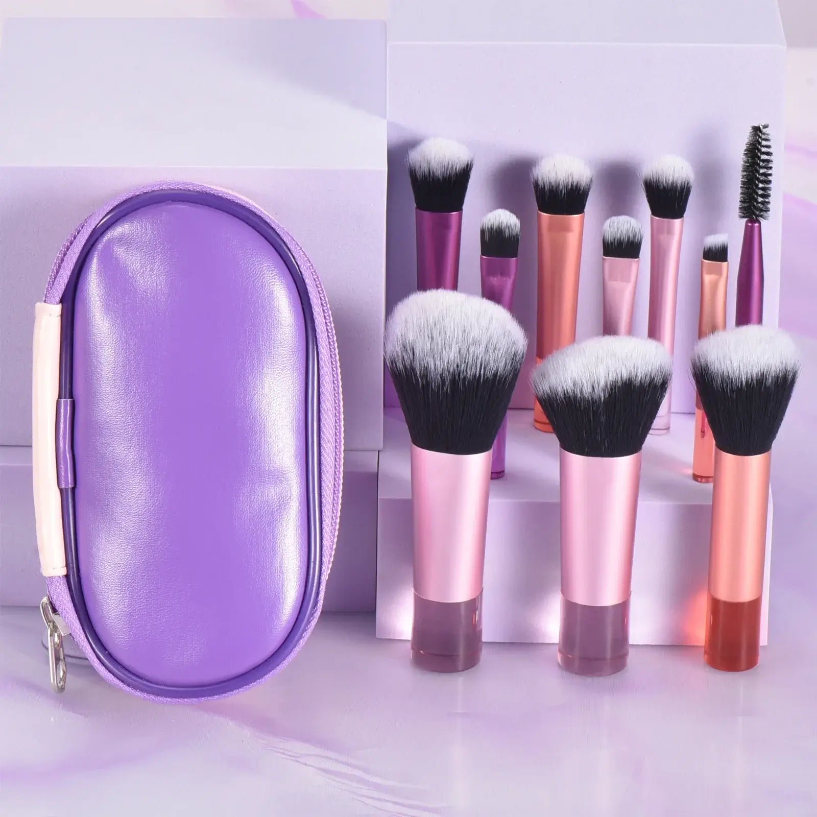 Set of 10 pink mini travel makeup brushes and puffs from amzzonstore, compact professional makeup tools for on-the-go application.